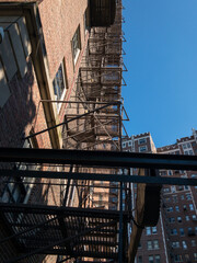 Fototapeta premium fire escape on side of building from below