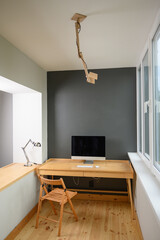 Photographer's workplace with professional camera and computer