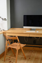 Photographer's workplace with professional camera and computer