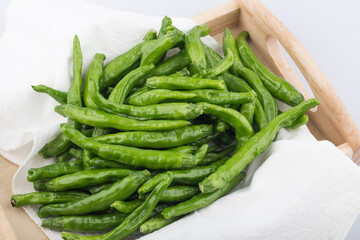 Green Organic Shishito Peppers in a bunch.