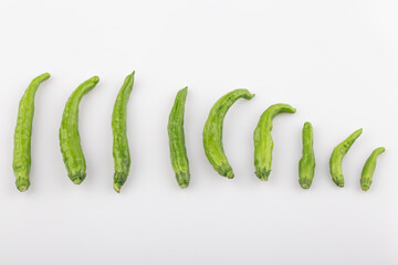 Green Organic Shishito Peppers in a bunch.