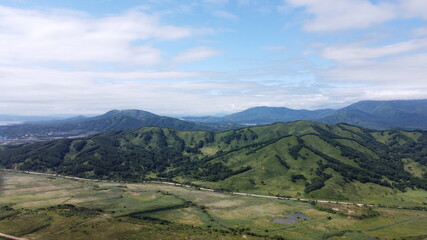 Fototapeta na wymiar Aerial view on a road between hills
