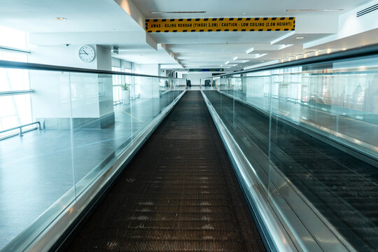 A travelator in an empty airport corridor during the coronavirus pandemic.