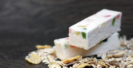 Fototapeta na wymiar White marshmallow with marmalade crumbs, dessert