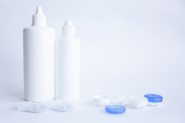 Contact lenses lens care products in white bottles on white background lens containers