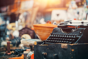 macro old typewriter on countertop in sunday flea market