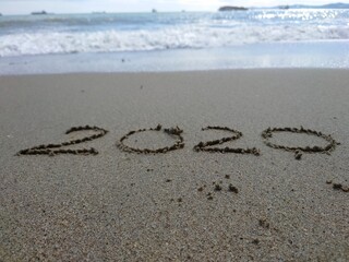 2020 sing made on wet sand