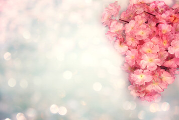 spring background flowering white sakura cherry flowers tree and abstract bokeh