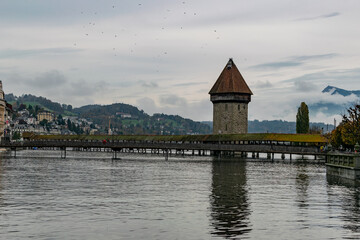 Kapellbrücke Luzern cloudy afternoon with Swiss Alps reflection