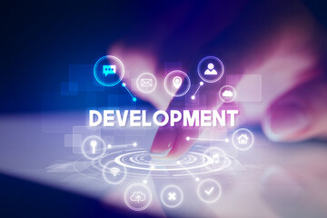 Finger touching tablet with web technology icons and DEVELOPMENT inscription, web technology concept