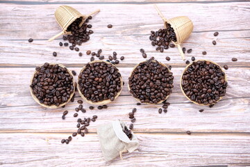 Top view coffee cup and coffee beans on old wood table background, space for text