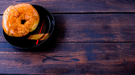 Freshly croissant on wooden background. It is a type of French pastry suitable as breakfast. It can be purchased at bakery worldwide.