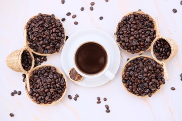 coffee cup and coffee beans on old wood table background