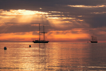 tall ship with sun rays