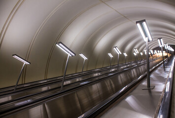 Perspective of the Moscow metro escalator Russia with modern lighting fixtures