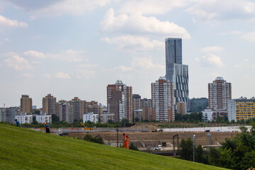 Fototapeta na wymiar view of modern residential buildings against a cloudy sky and space for copying in Moscow Russia