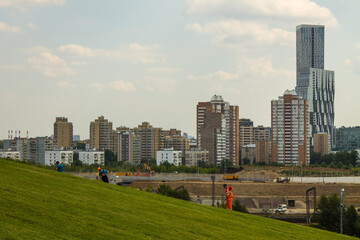 Fototapeta na wymiar view of modern residential buildings against a cloudy sky and space for copying in Moscow Russia