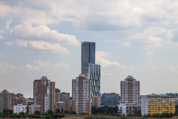view of modern residential buildings against a cloudy sky and space for copying in Moscow Russia