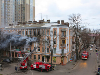 Odessa, Ukraine - December 29, 2016: A fire in apartment building. Strong bright light and clubs,...