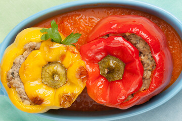 Baked pepper stuffed with chopped meat in tomato sauce.