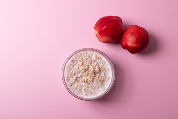 morning oat meal in a glass bowl with peaches 