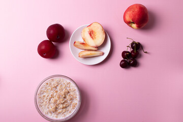 morning oat meal in a glass bowl with peaches 