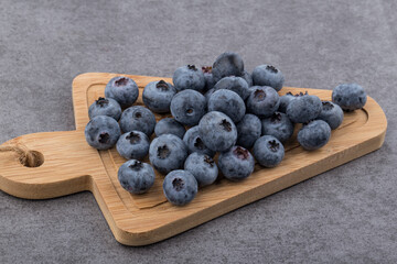 organic superfood blueberry berries on a gray background.
