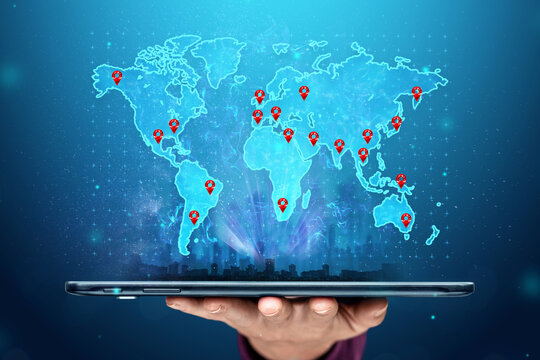 Close-up of a tablet in hands with a picture of a map of the whole world. New technologies. Copy space.