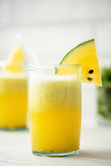 yellow watermelon smoothie in large glasses