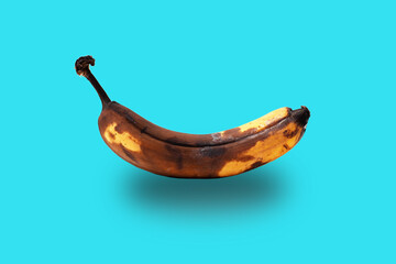 Stale banana isolated on blue background