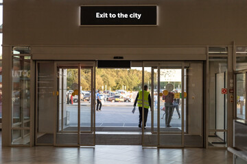 door at the airport with the inscription exit to the city