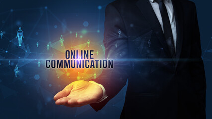 Elegant hand holding ONLINE COMMUNICATION inscription, social networking concept