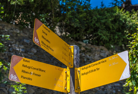 Spain, Catalonia, Pyrenees, Vall de Nuria, village of Queralbs, directional hiking trails signs