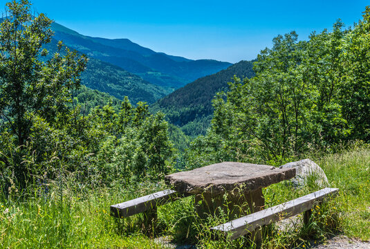 Spain, Catalonia, Pyrenees, Vall de Nuria, village of Queralbs, picnic table next to the road