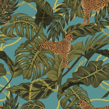 Trendy seamless pattern with chains and tropical leaves on leopa © zhanstudio