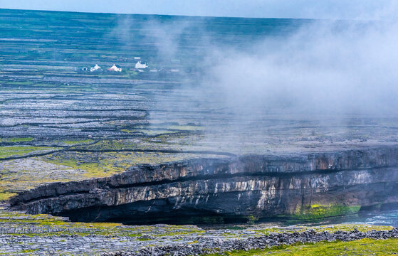 Europe, Republic of Ireland, County Galway, Aran Islands, Inishmore Island, cliffs dug by the sea near the Dun Aengus prehistorical Ringfort site (Aon