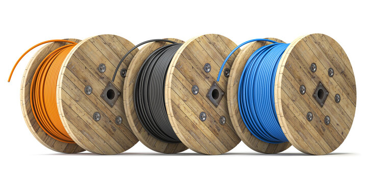 Wire electric cable of different colors on wooden coil or spool isolated on white background.