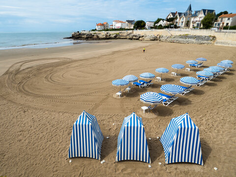Beach cabin and umbrellas on the Pontaillac beach, Royan, France