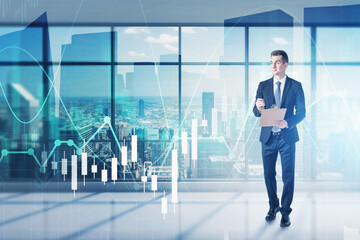 Man with clipboard in office, financial chart