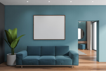 Blue living room with sofa and poster