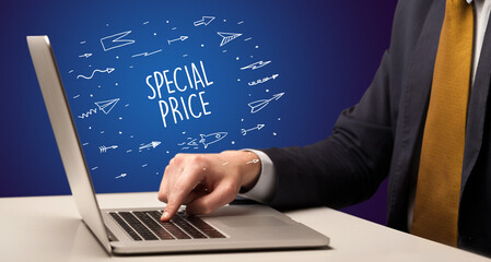 Businessman working on laptop with SPECIAL PRICE inscription, online shopping concept