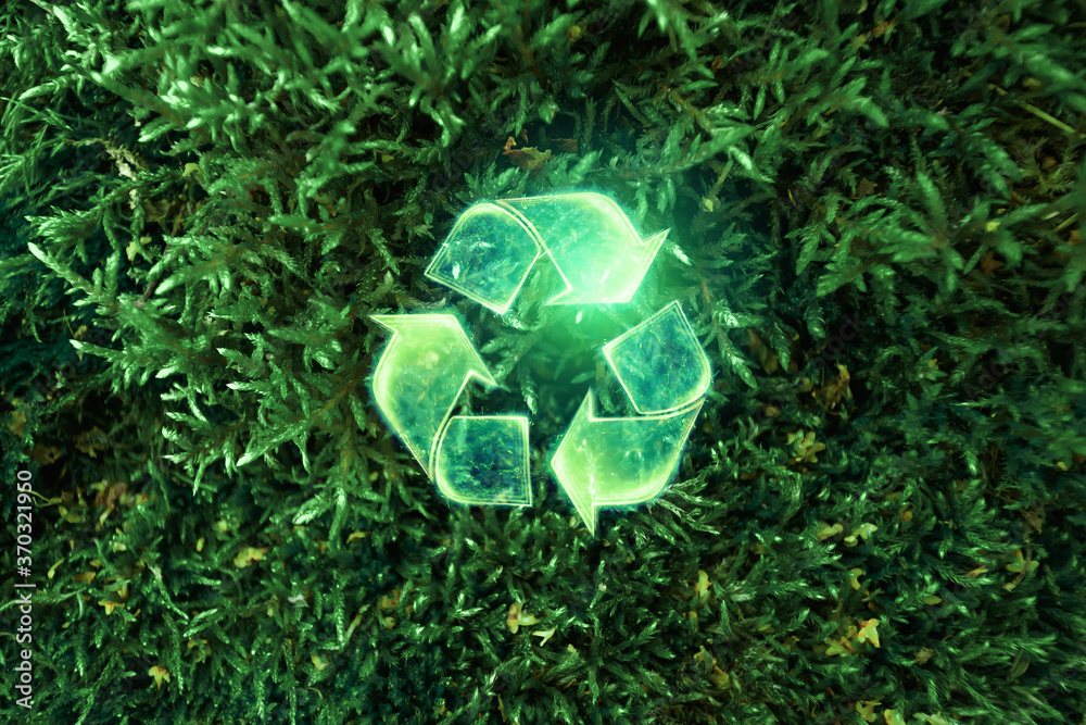 Wall mural sign recycling hologram on a green background. eco recycling green symbol. the concept of clean land