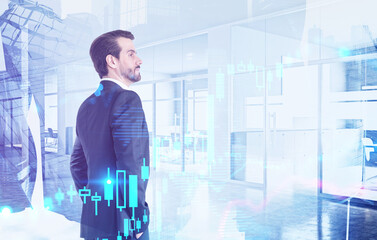 Fototapeta premium Confident businessman in office, financial graph