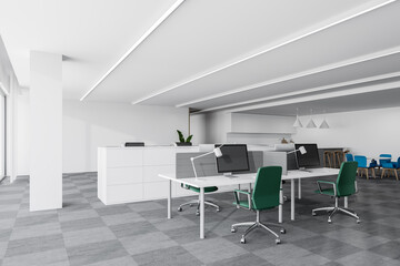 White office corner with green chairs