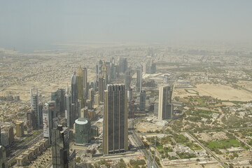 Fototapeta na wymiar Tall buildings in the future city, Dubai. The picture from a hight