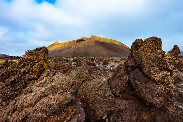 Barren volcanic landscape with El Cuervo (