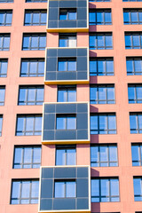 Exterior of modern architecture in the city center. Construction abstract background. Detail of the facade with windows.