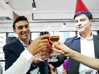 Happiness business persons happy new year party in the offices.