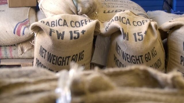 Arabica coffee beans in bags - coffee storing in roasting company