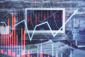 Forex market chart hologram and personal computer background. Double exposure. Concept of investment.